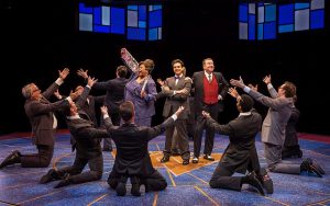 Felicia Fields (Miss Jones), Ari Butler (J. Pierrepont Finch) and Terry Hamilton (J.B. Bigley) and company. Marriott Theatre photo