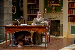 Erik Hellman (Arthur) hides under the desk from Lydia protected by Emily Berman (Mary) Charles Osgood Photography