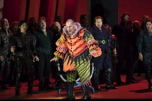 Rigoletto (Quinn Kelsey) center and couriers in )Lyric Opera production of Verdi's Rigoletto. (Todd Rosenberg photo)