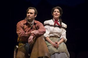 Brandon Springman (Curly) and Jennie Sophia (Laurey) imagine riding on a surrey driven by snow-white horses in 'Oklahoma' at Marriott Theatre. (Photos by Liz Lauren)