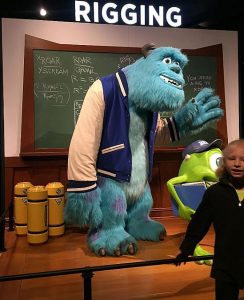 Posing with a Pixar character is part of the exhibit experience.