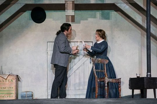 Michael Fabiano (Rodolfo) and Maria Agresta (Mimi) meet when she comes to his garret. (Todd Rosenberg photo)