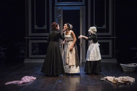 Heidi Kettenring (Mrs. Norris) tells Kayla Cargter (Fanny Price) she can never say no at Mansfield Park while Kate Hamill (a maid) helps change Price's clothing. (Michael Brosilow photos)
