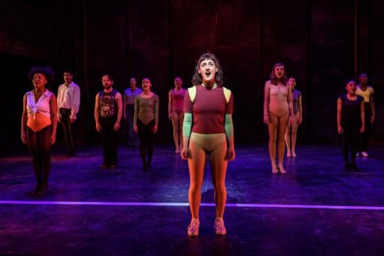 (in spotlight) Adrienne Storrs as Diana Morales sings "What I Did for Love" in 'A chorus Line' at Porchlight Music Theatre. (Photo by Michael Courier)