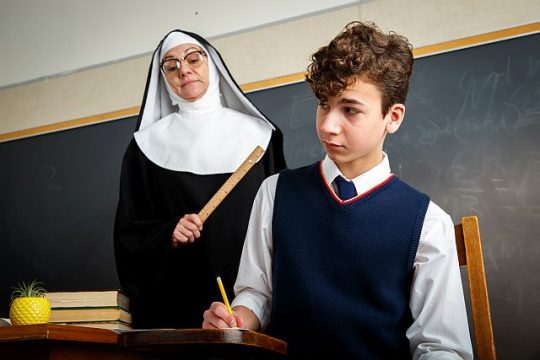 Janet Ulrich Brooks as Sister Clarissa and Logan Baffico as Rudy in Theatre at the Center's production of "Over The Tavern." (Photo by Guy Rhodes)