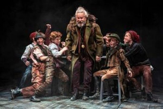 William Brown (center) stars as aging pickpocket Fagin in “Oliver!” at the Marriott Theatre. (Liz Lauren photo)