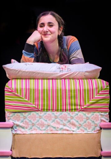 Ruth (Marielle Nada Issa) finds it hard to sleep in The Princess and the Pea. (Photo courtesy of Marriott Theatre)
