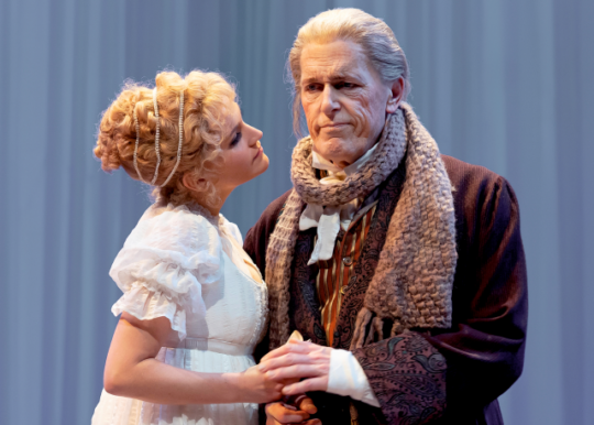 Emma (Lora Lee Gayer) comforts her father, Mr. Woodhouse (Larry Yando) in Emma at Chicago Shakespeare. (Photo by Liz Lauren)