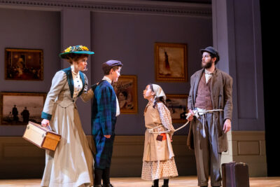 Affluent Mother (Kelly Britt) and young brother (Ryan Dooley) meet immigrant family of young girl (Omi Lichtenstein) and Tateh (Dan Gold). (Photo Credit: Brett Beiner)