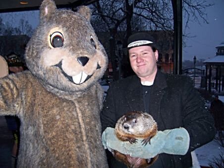 committee asks Woodstock Willie his forecast of when Spring will come. (J Jacobs photo