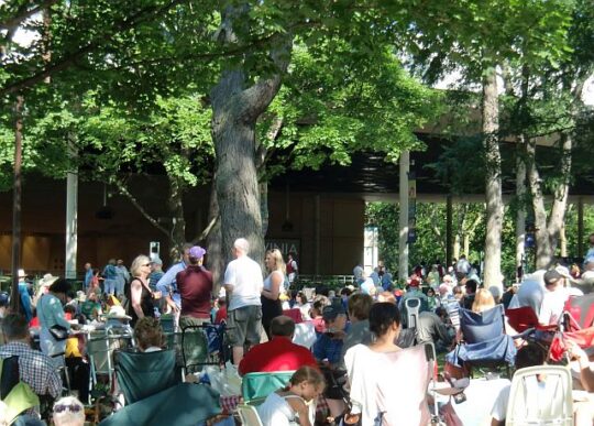 Concert goers picnic behind the Pavilion. Ravinia Festival draws music lovers to Highland Park each summer. (J Jacobs photo)